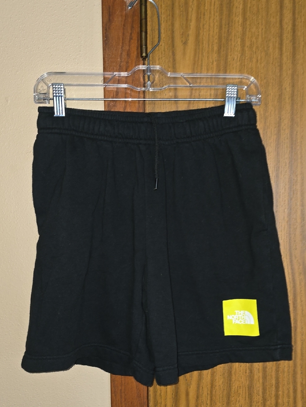 The North Face Black Shorts with Yellow Logo Patch
